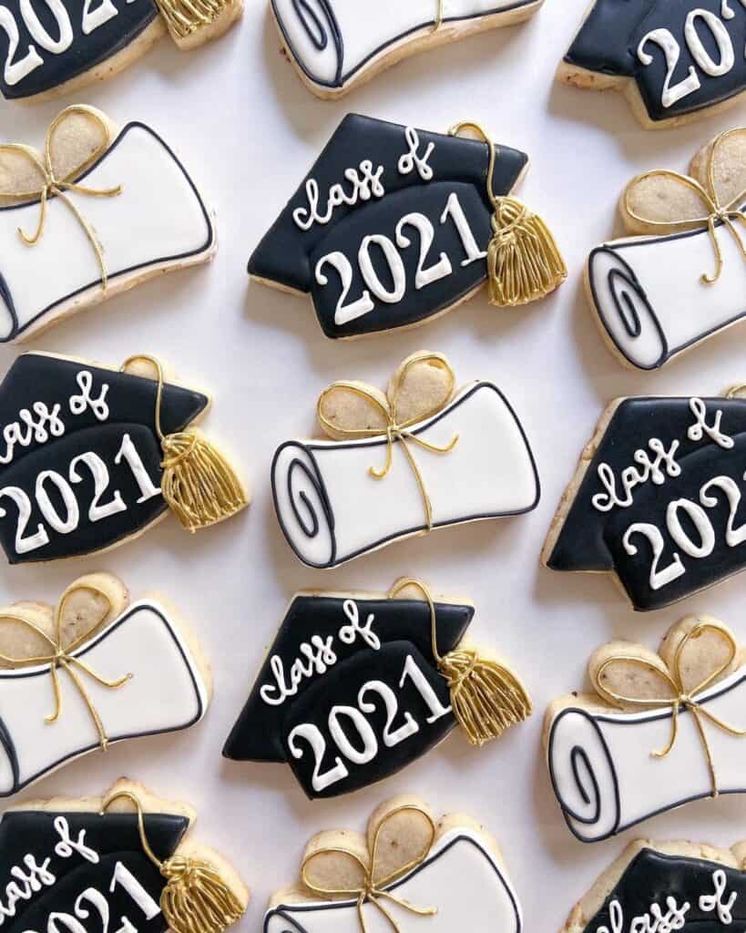 graduation party custom cookies in the shape of graduation diploma and graduation caps