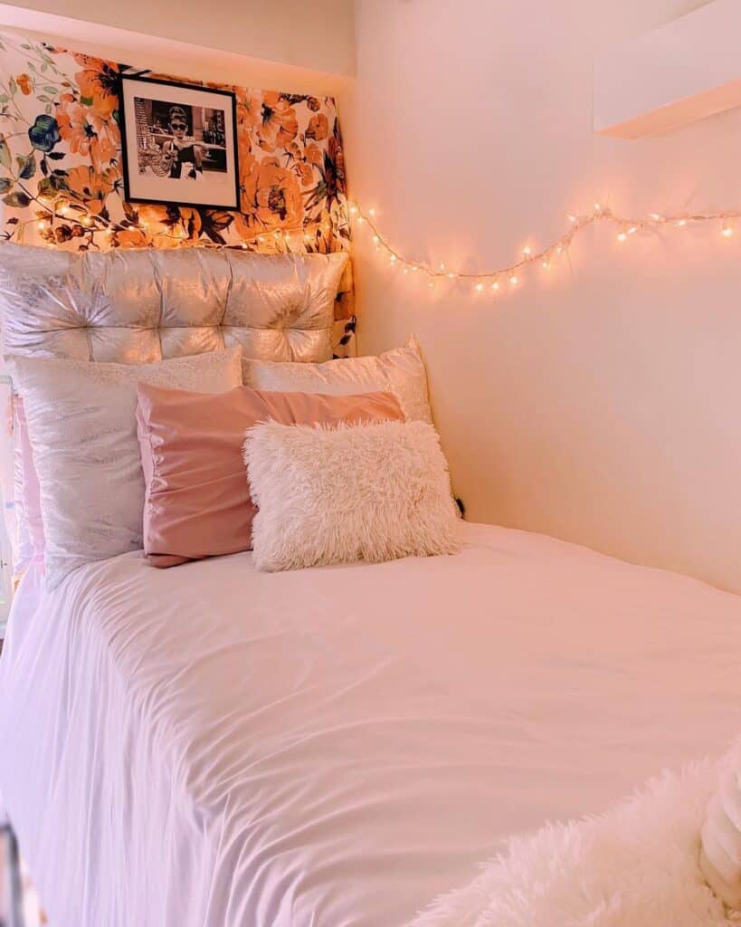 Simple dorm room decorated with LED lights and throw pillows