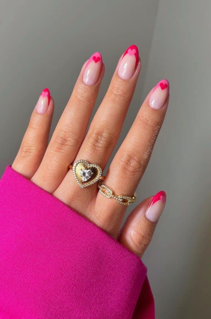 Pink French Tip nails with mini hearts